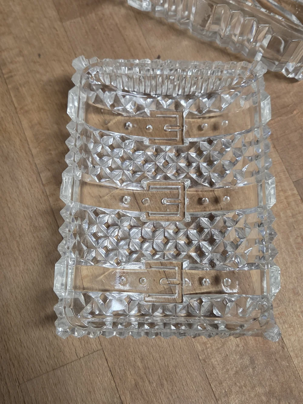 Vintage clear pressed glass trinket box shaped like a miniature treasure chest